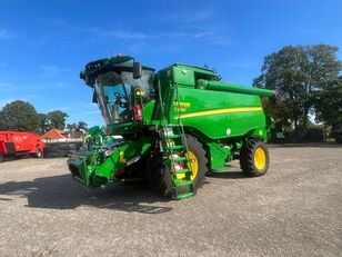 new John Deere T560 grain harvester
